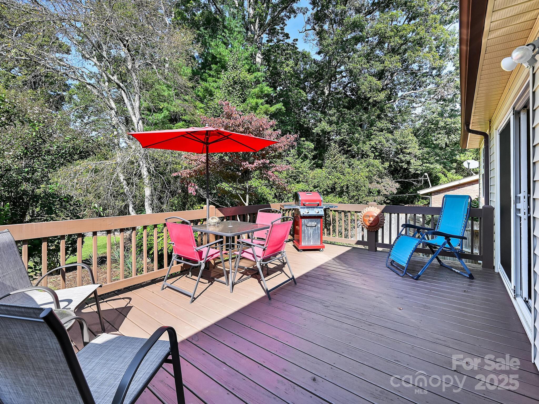 402 Balsam Road Hendersonville, NC 28792 - Photo 10 of 26 an outdoor space with furniture and umbrella