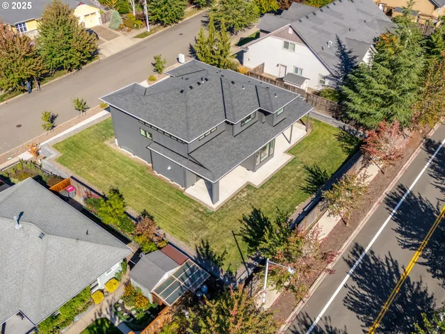 a view of a house with a yard and mountain