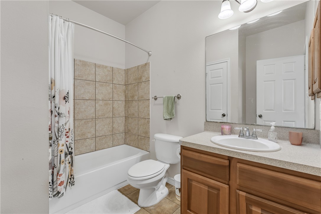 1425 West Villa Maria Road, Unit 1004 Bryan, TX 77801 - Photo 16 of 23 a bathroom with a sink a toilet and shower