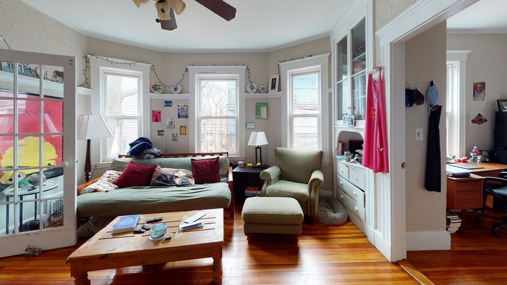 8 Olmstead Street, Unit 1 Boston, MA 02130 - Photo 2 of 11 a living room with furniture and a flat screen tv
