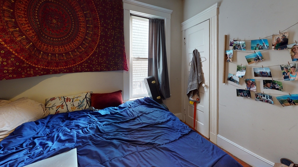 8 Olmstead Street, Unit 1 Boston, MA 02130 - Photo 7 of 11 a bedroom with a bed and a window