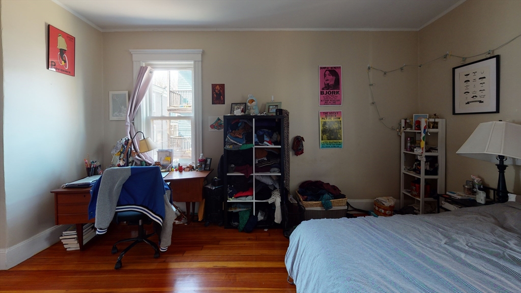 8 Olmstead Street, Unit 1 Boston, MA 02130 - Photo 8 of 11 a bedroom with furniture and a window