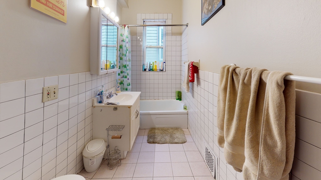 8 Olmstead Street, Unit 1 Boston, MA 02130 - Photo 10 of 11 a bathroom with a sink toilet and shower