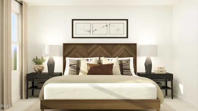 a bedroom with a bed and painting on the wall