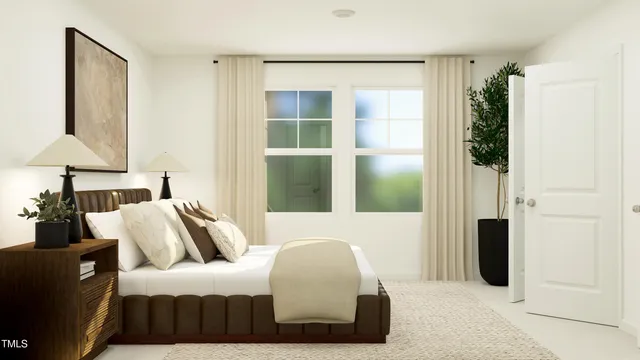 a bedroom with furniture and a window
