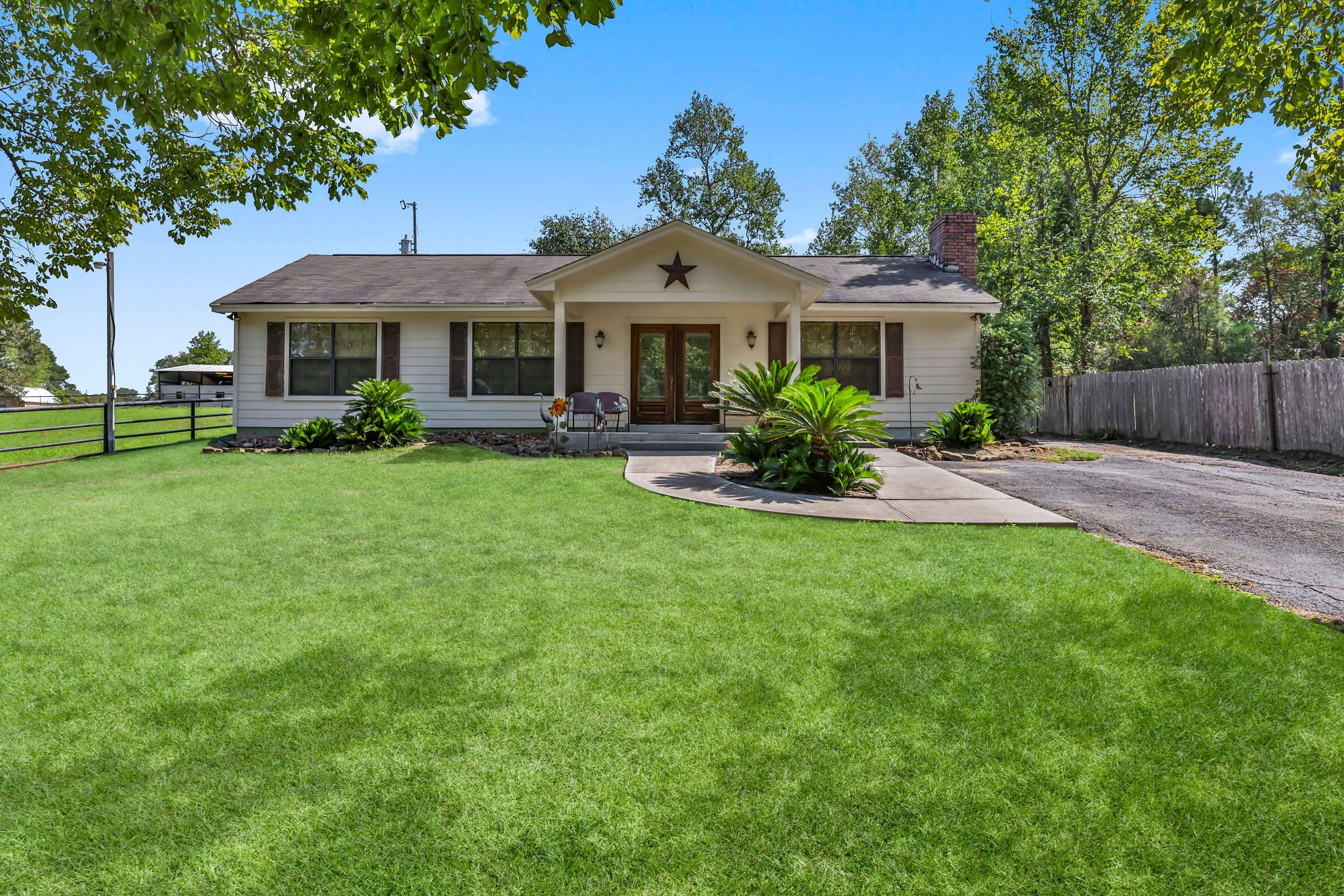 a front view of a house with garden