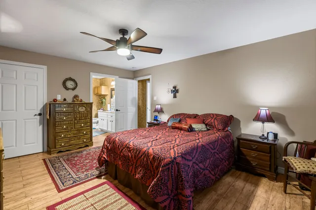 a bedroom with a bed dresser and a window