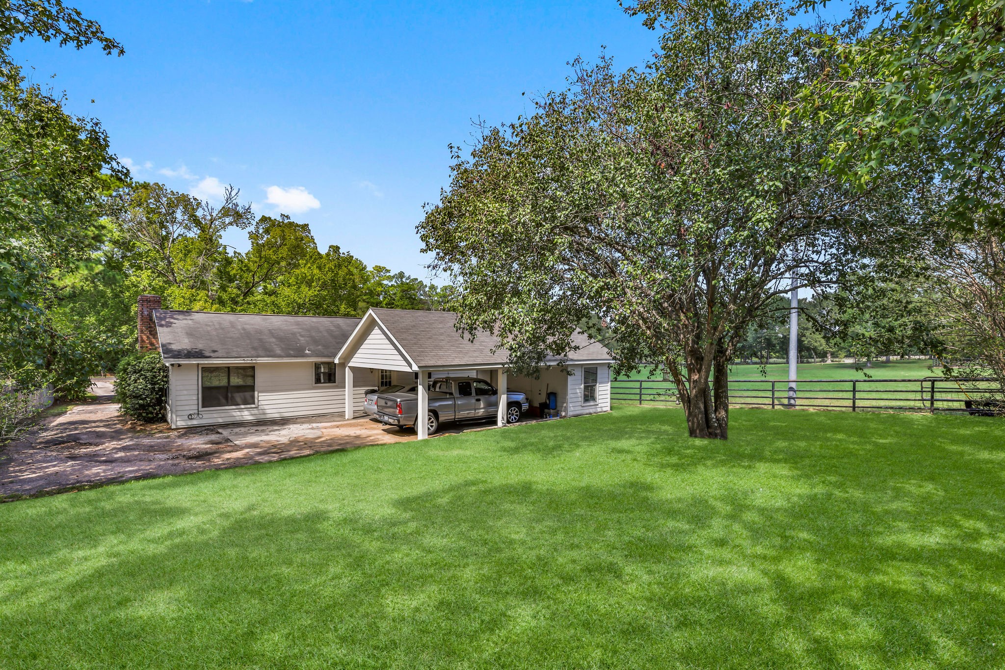 19094 FM 2854 Road Montgomery, TX 77316 - Photo 15 of 16 a view of a house with a big yard and large trees