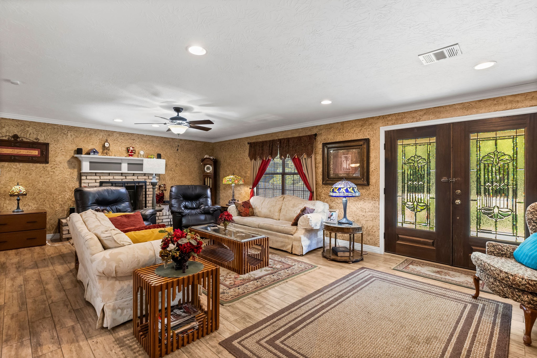 19094 FM 2854 Road Montgomery, TX 77316 - Photo 5 of 16 a living room with furniture a large window and a chandelier