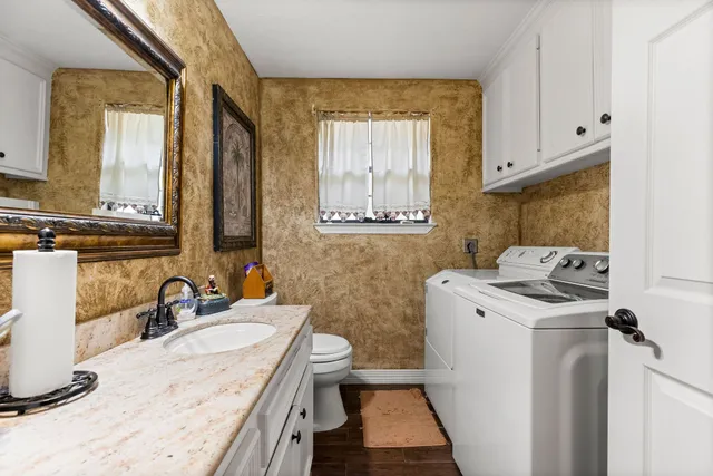 a bathroom with a sink and a washing machine