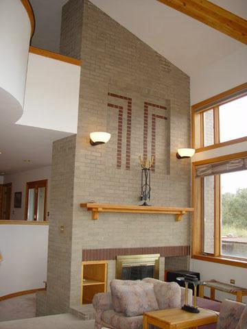 10030 High Bluff Drive Placerville, CO 81430 - Photo 5 of 6 a living room with furniture and large windows
