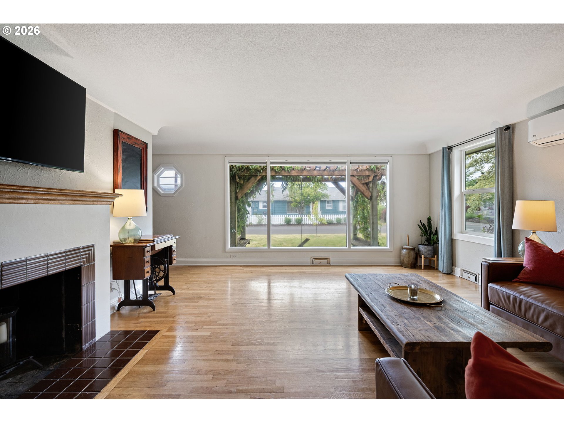 765 Louis Street Eugene, OR 97402 - Photo 5 of 45 a living room with furniture and a fireplace