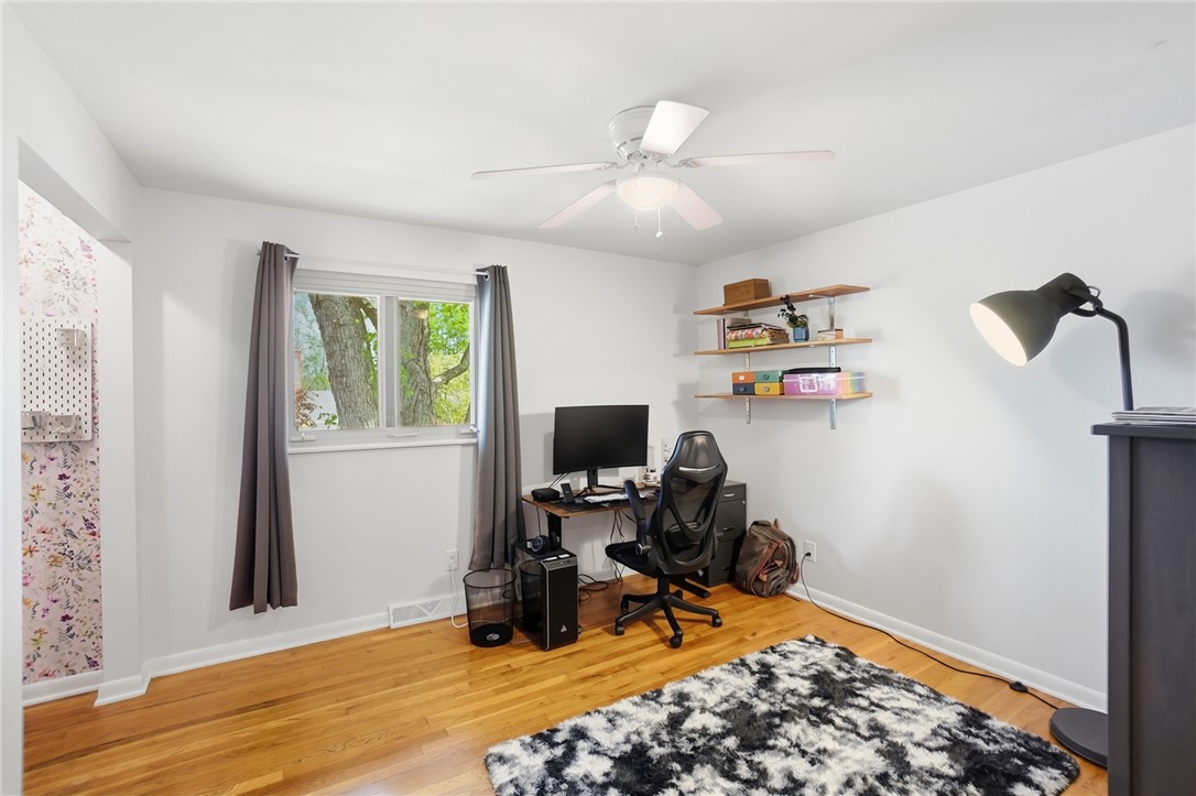 150 Littlejohn Road Troy, OH 45373 - Photo 26 of 40 This versatile room features warm hardwood floors and a bright window, creating an inviting atmosphere.