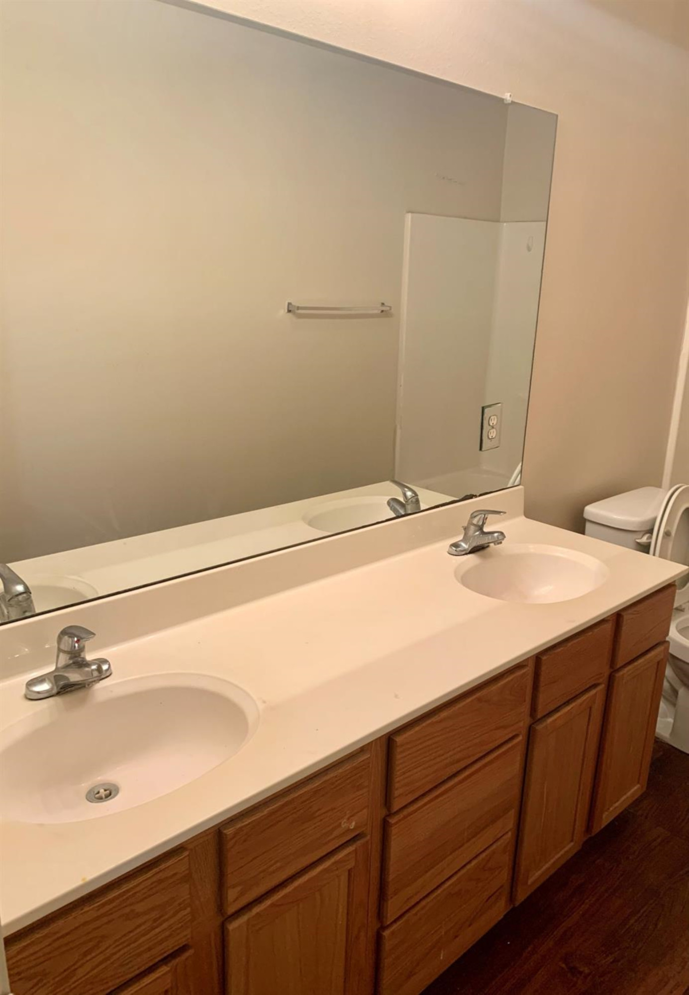 1108 82nd Street, Unit A Lubbock, TX 79423 - Photo 6 of 8 a bathroom with a sink and a mirror