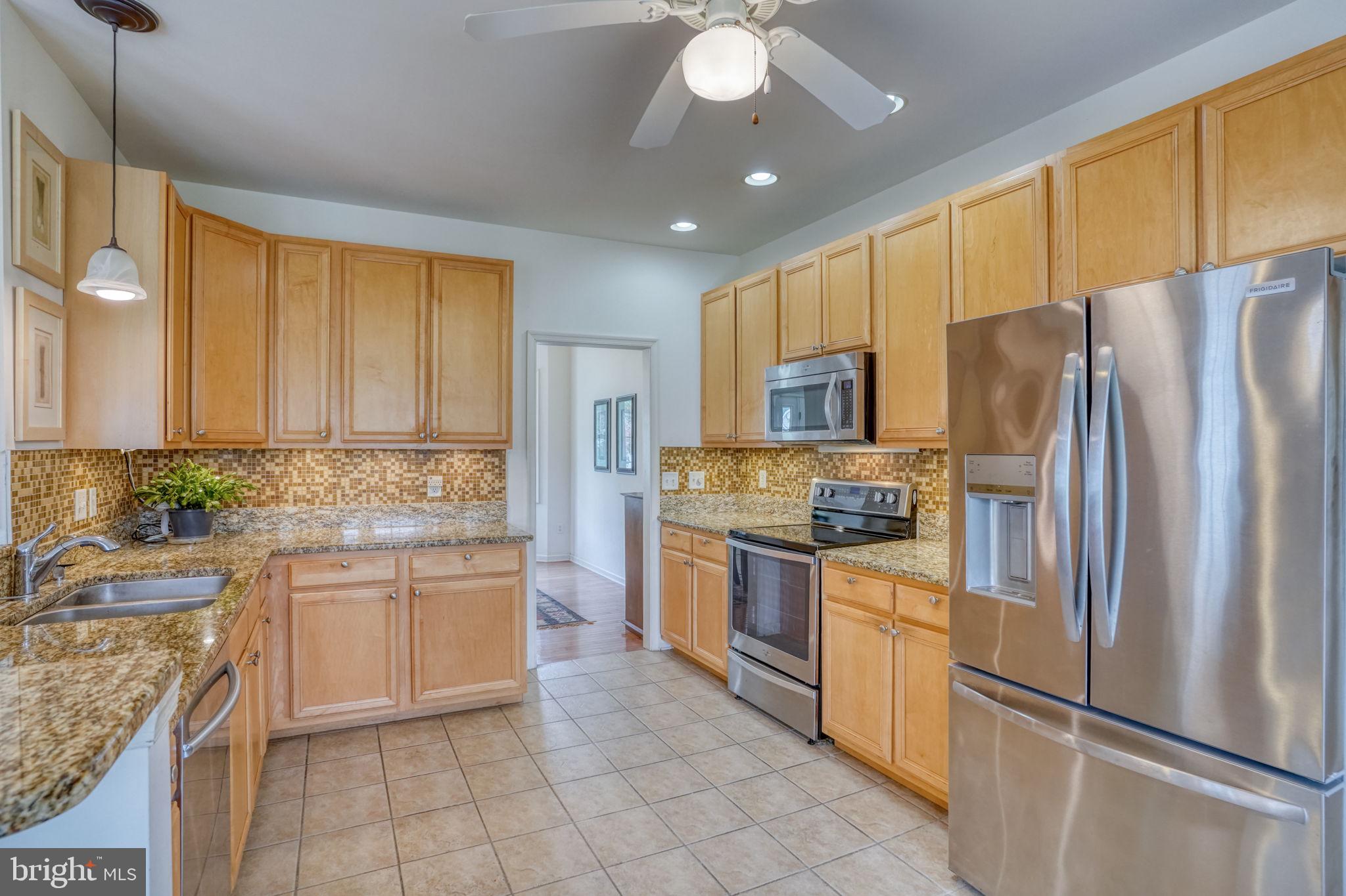 36 Kenmare Way Rehoboth Beach, DE 19971 - Photo 13 of 62 Tile kitchen with a view to the dining room.