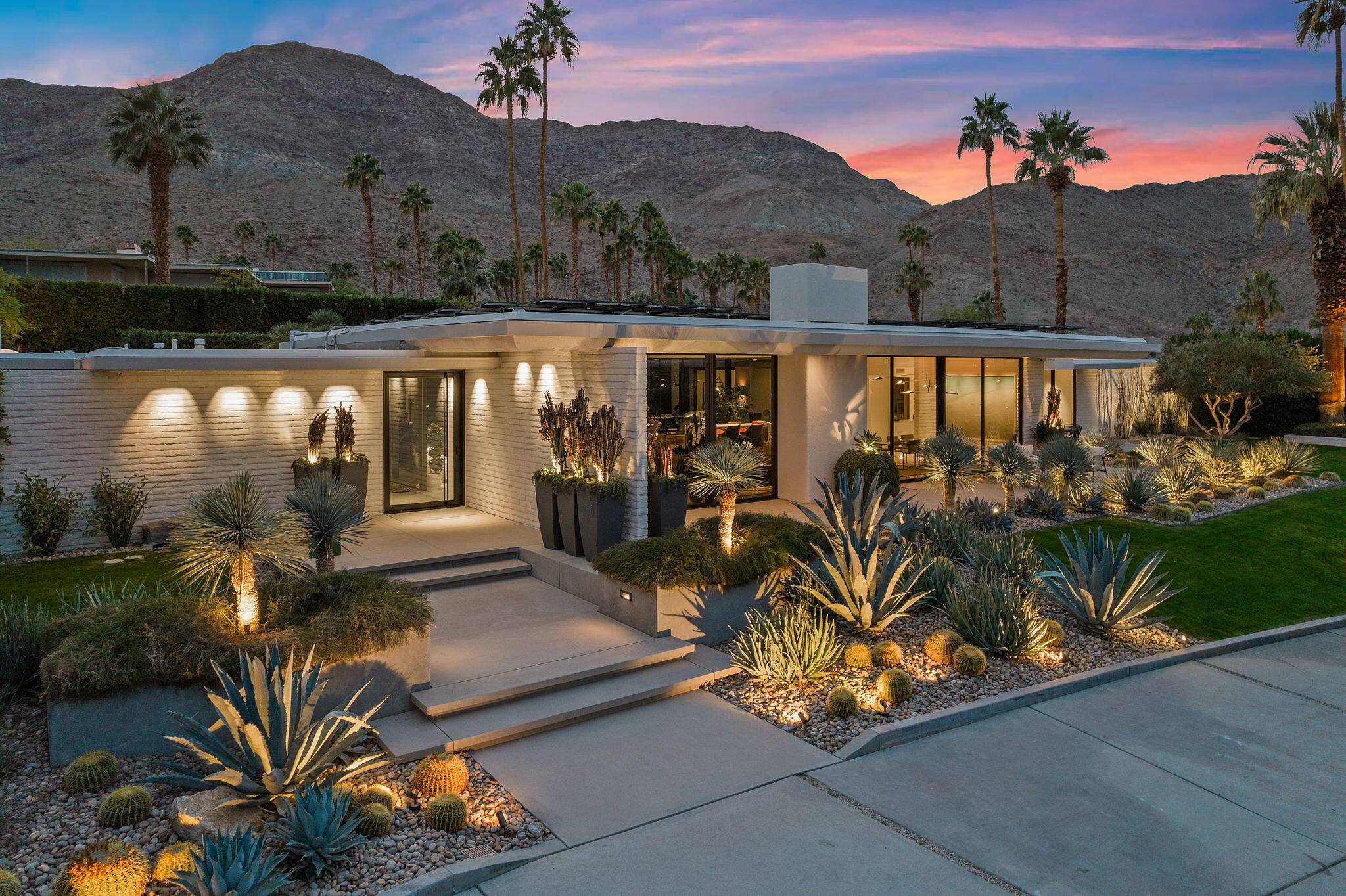70149 Sonora Road Rancho Mirage, CA 92270 - Photo 1 of 74 a view of a patio with lawn chairs potted plants with wooden floor and lake view