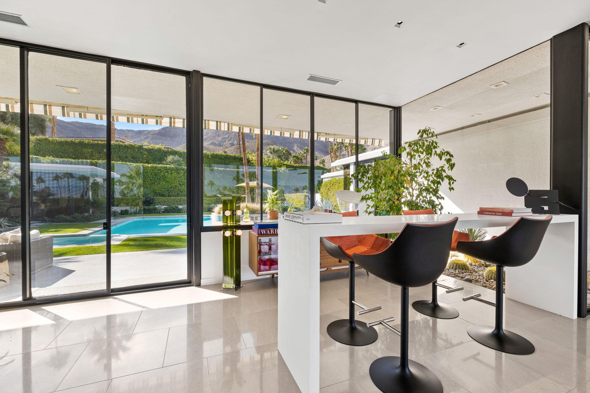 70149 Sonora Road Rancho Mirage, CA 92270 - Photo 17 of 74 a living room with furniture and a potted plant