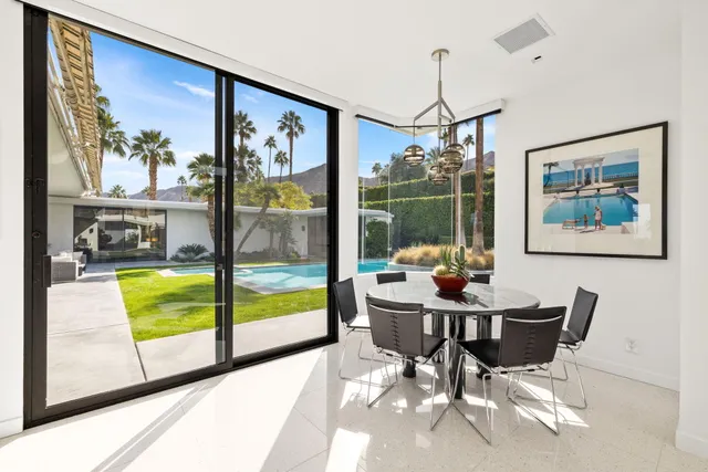 a living room with furniture and windows