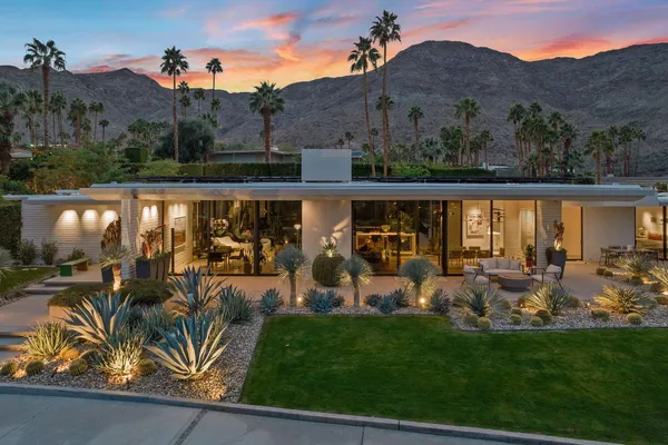 a view of a chairs and table in patio