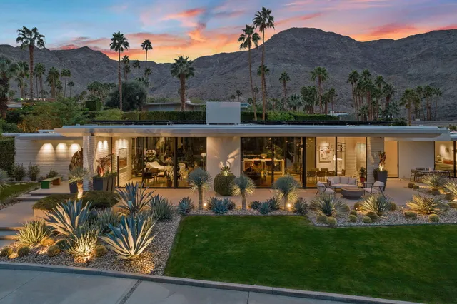 a view of a chairs and table in patio