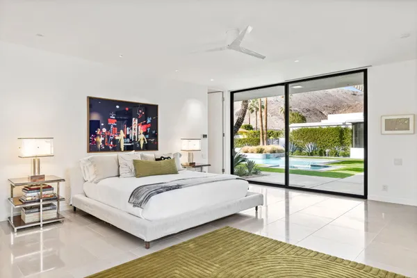 a view of a park with a slide and a lake view