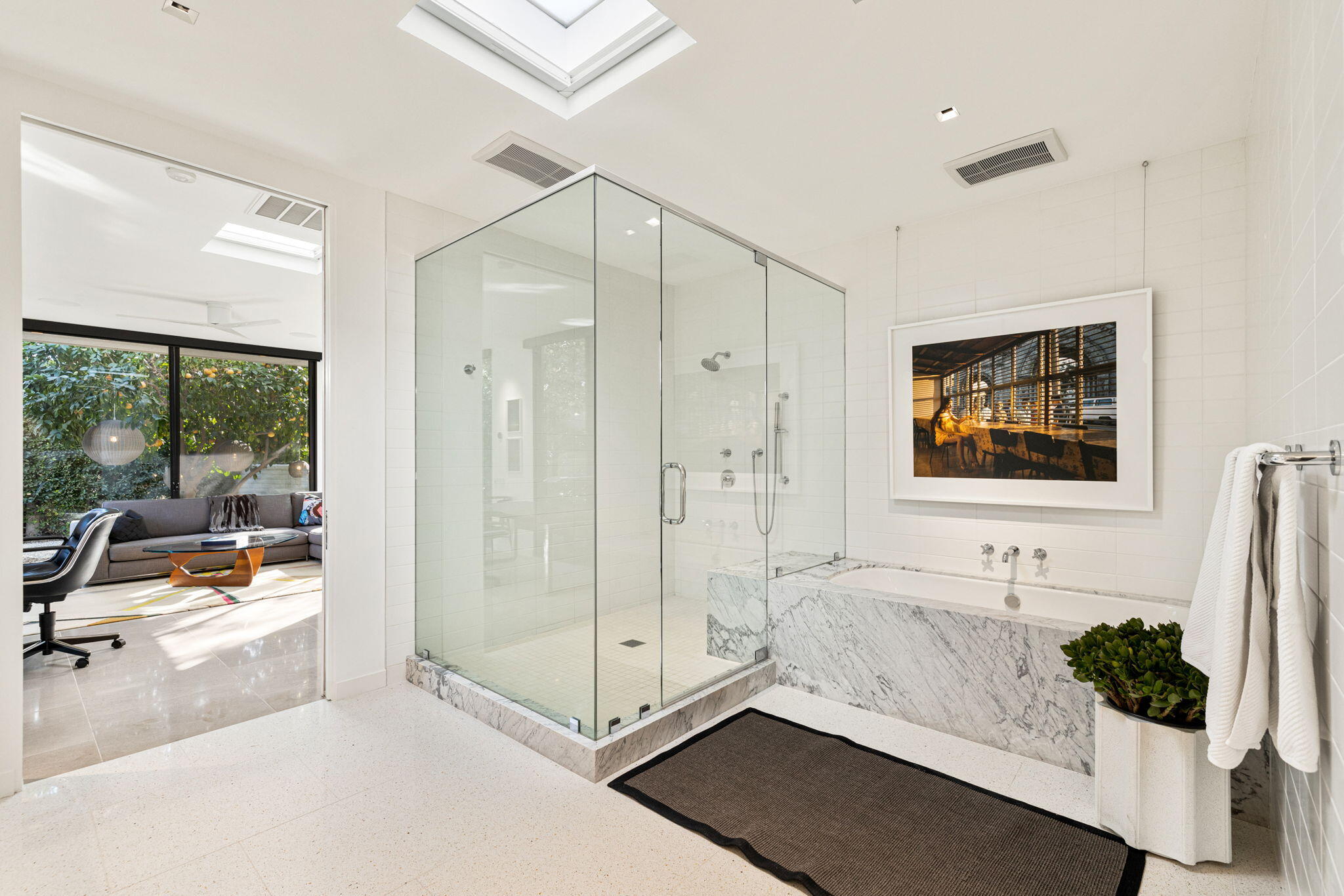 70149 Sonora Road Rancho Mirage, CA 92270 - Photo 34 of 74 a spacious bathroom with a double vanity sink and a large mirror next to a shower