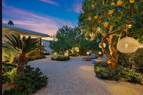 a bedroom with furniture and a flat screen tv