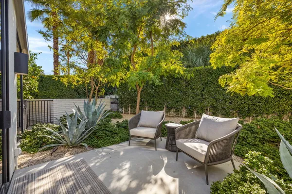 a bedroom with a bed and a flat tv screen
