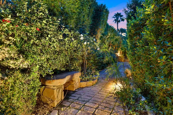 a living room with patio furniture and a yard