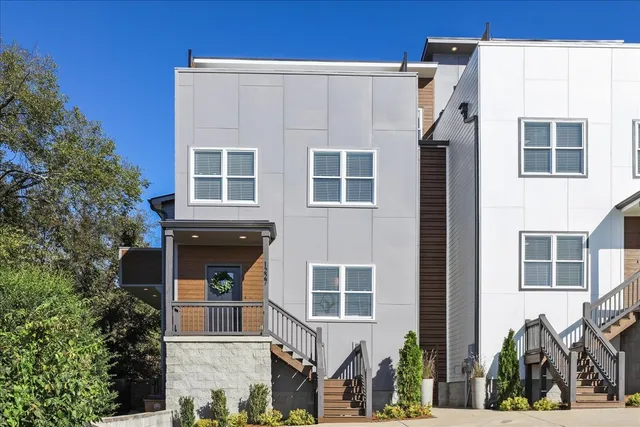 a view of a blue building with large windows