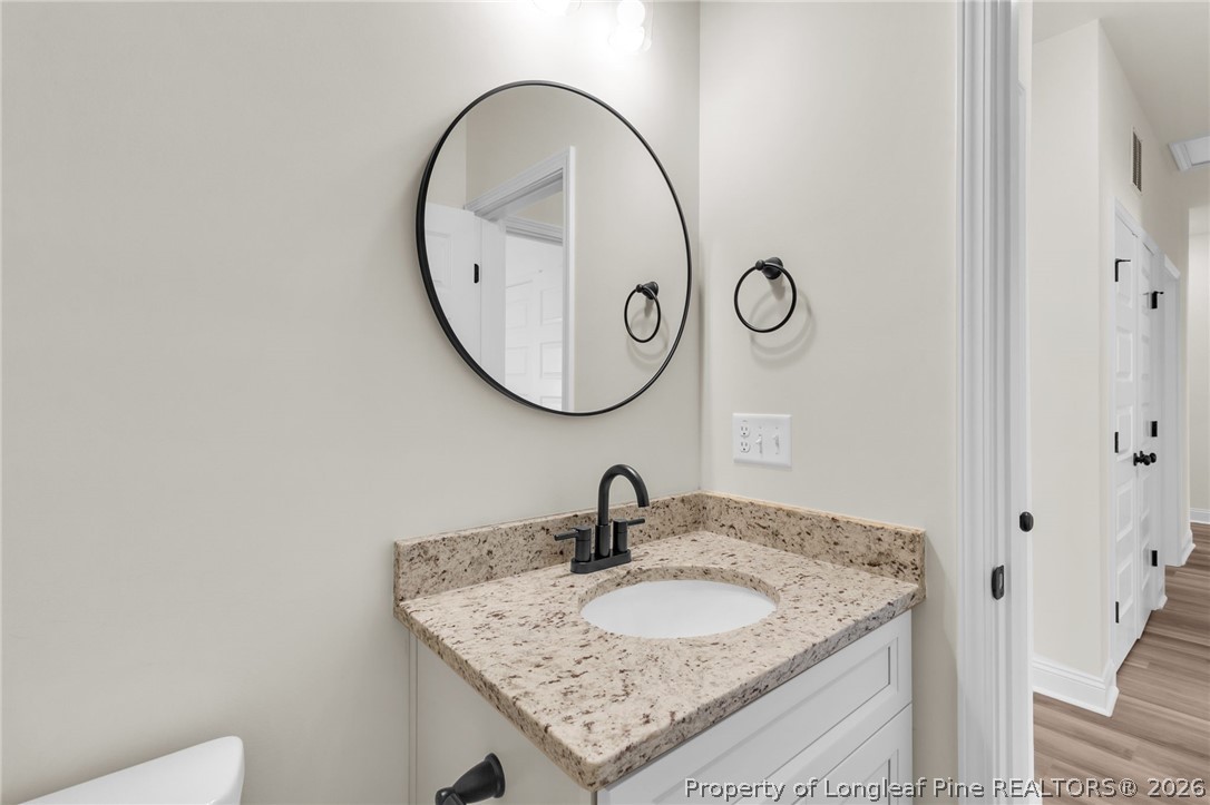 131 Merle Road Pinebluff, NC 28373 - Photo 25 of 33 a bathroom with a sink and a mirror
