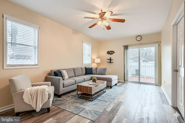 a spacious bedroom with a bed a couch and a window