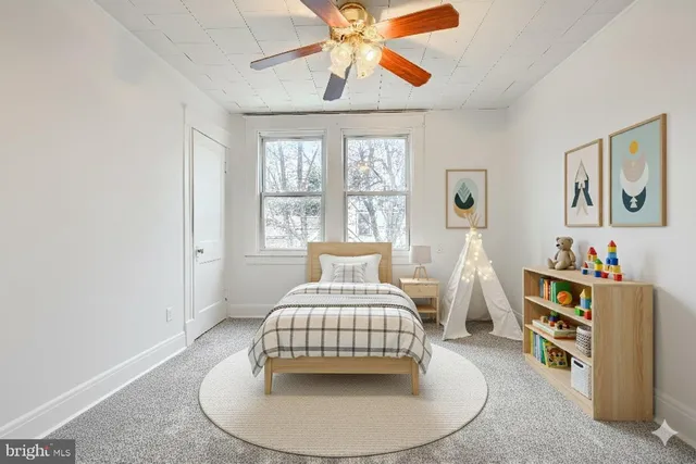 a bedroom with a bed and window