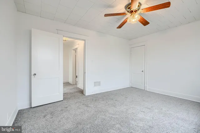 a living room with furniture and stairs
