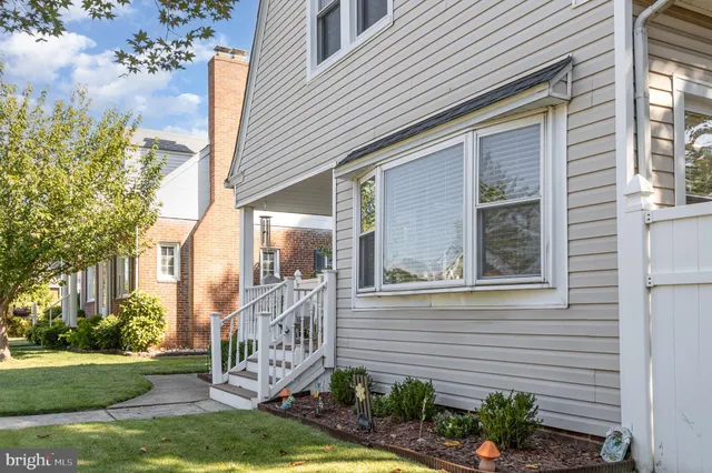 a view of a brick house with a large windows
