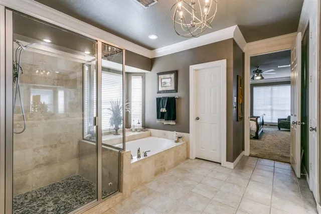 a spacious bathroom with a tub shower and mirror