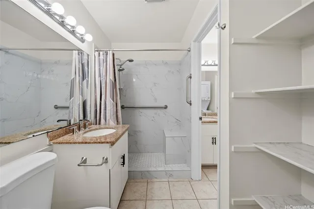 a bathroom with a granite countertop shower sink and mirror