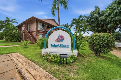 a view of swimming pool with a yard and plants