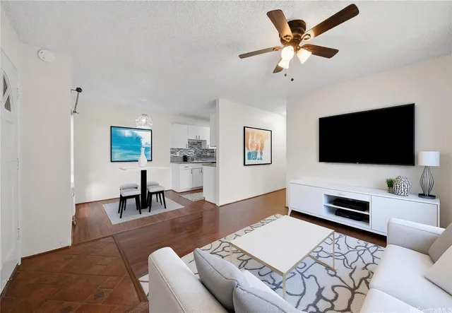 a living room with furniture and a flat screen tv