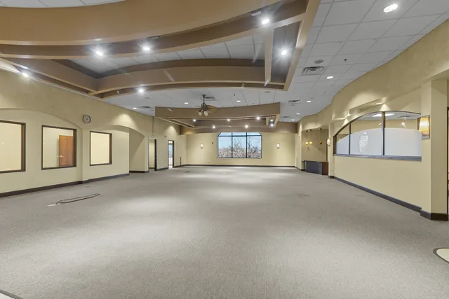 an empty room with wooden floor