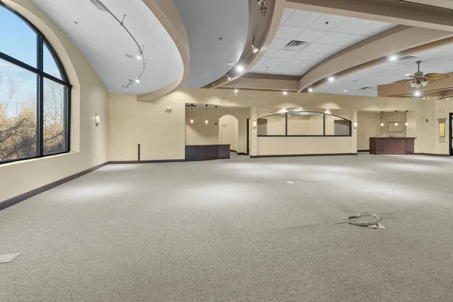 a view of a workspace with furniture