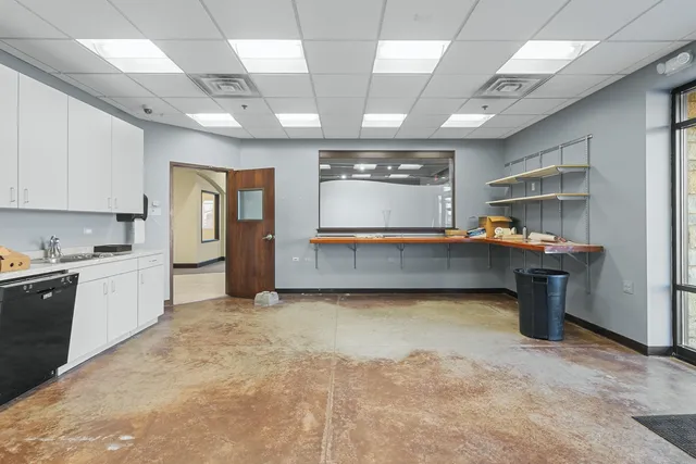 a view of an empty room with a fireplace