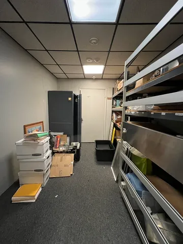 a kitchen with a sink appliances and cabinets