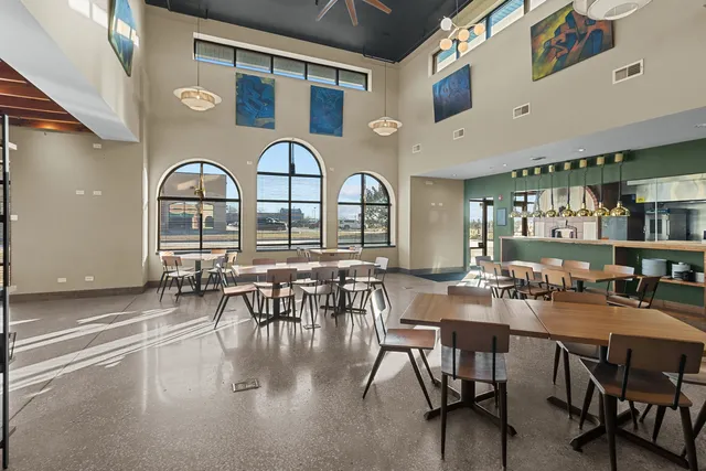 a view of living room with furniture and a fireplace