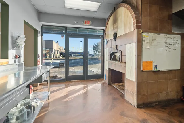 a view of a room with lots of wooden furniture