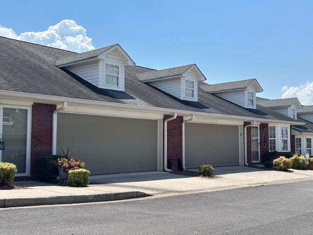115 Old Mill Drive Calhoun, GA 30701 - Photo 2 of 28 a front view of a house with garage