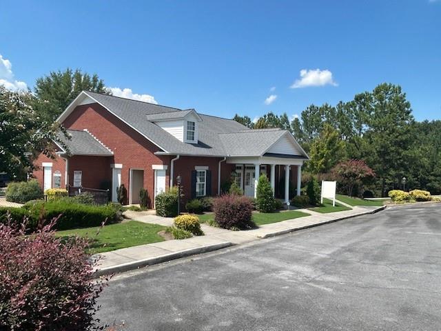 115 Old Mill Drive Calhoun, GA 30701 - Photo 21 of 28 a front view of a house with a yard