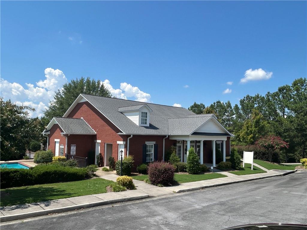 115 Old Mill Drive Calhoun, GA 30701 - Photo 22 of 28 a front view of a house with a yard