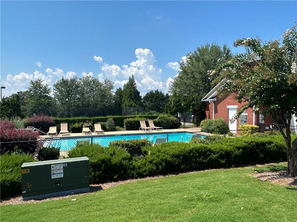 115 Old Mill Drive Calhoun, GA 30701 - Photo 23 of 28 a front view of house with yard and green space