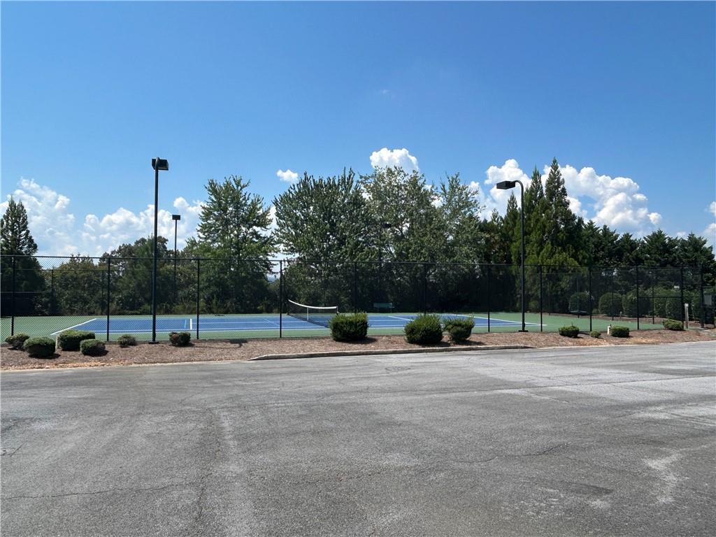 115 Old Mill Drive Calhoun, GA 30701 - Photo 25 of 28 a view of outdoor space with swimming pool and trees in the background